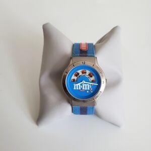 1999 Vintage M&M's Crispy Watch Blue Striped Buckle Band Round Face Silver Tone